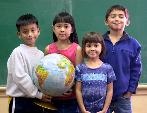 kids holding globe