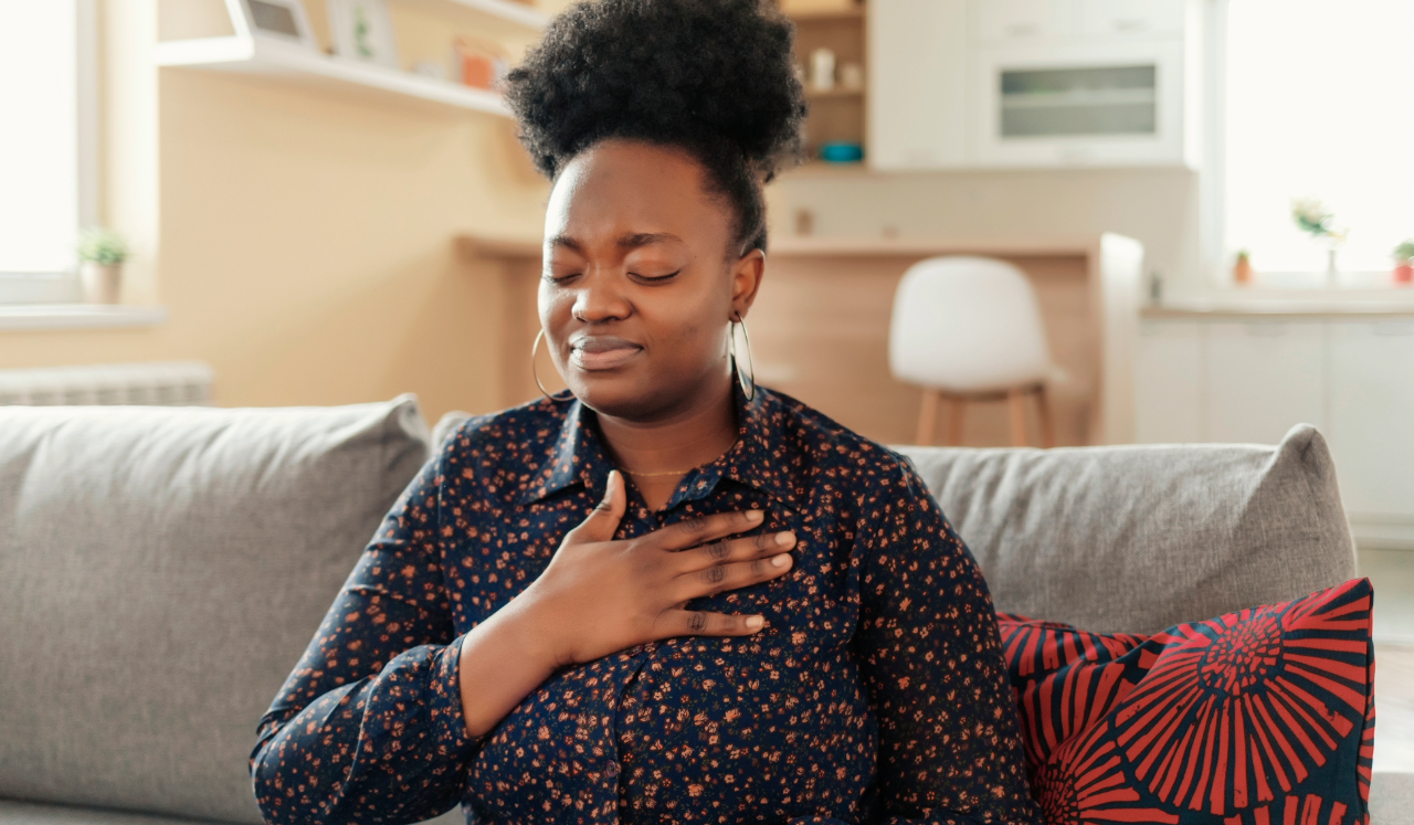 Woman clutching chest