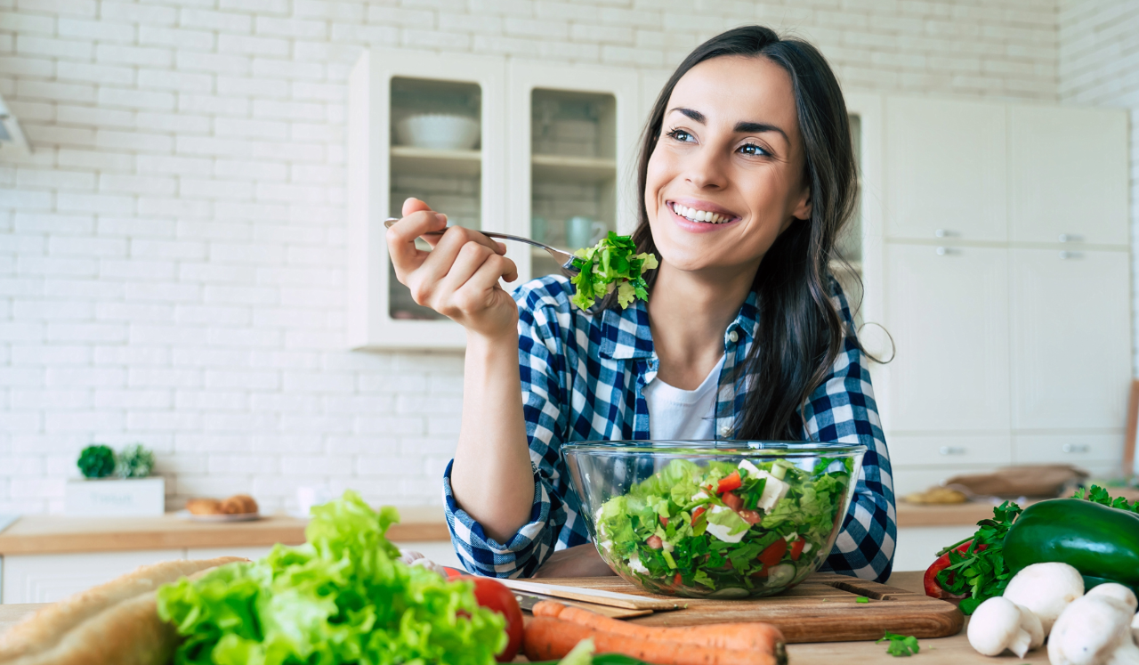 Woman eating salad