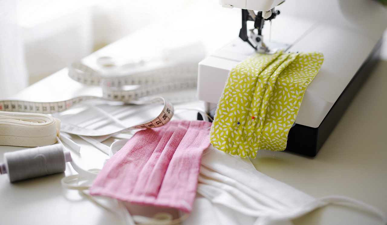 A sewing machine and items used for making fabric-based masks.