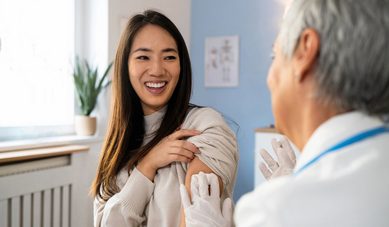 Doctor giving patient a vaccine