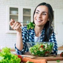 Woman eating salad