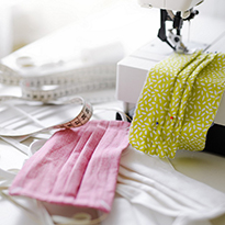 A sewing machine and items used for making fabric-based masks.