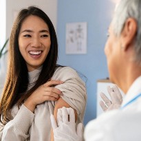 Doctor giving patient a vaccine