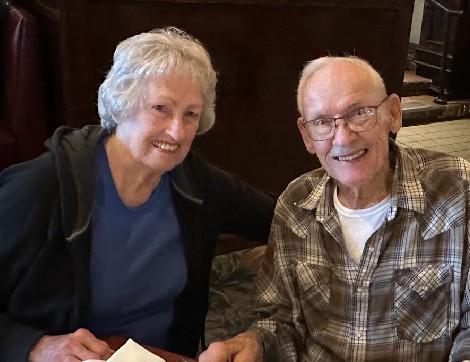 Cancer survivor, Deanna Owens smiles with her husband on a dinner date. 