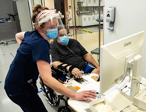 COVID patient Grant Lashley using assistive technology