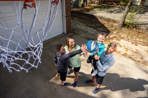 NewStart success stories, the Patranellas, share a moment with their children.