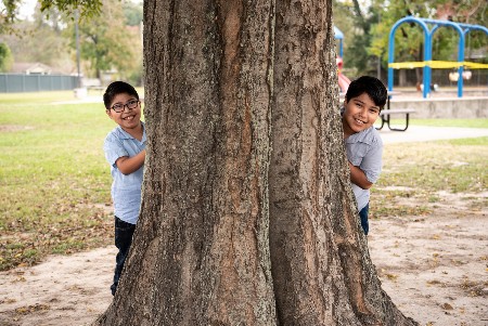 David and brother playing at park