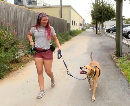 TIRR Memorial Hermann patient, Alese Zeman, walks her dog post-recovery.