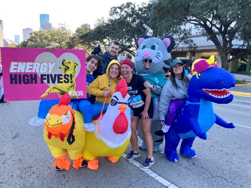 TIRR Memorial Hermann patient, Alese Zeman, stands with friends at an event.