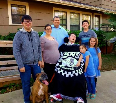 Nolan Whisenant, a TIRR Memorial Hermann patient, is photographed with his family.