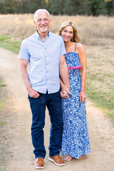 Trauma patient and survivor, Gary, stands proudly with his wife.