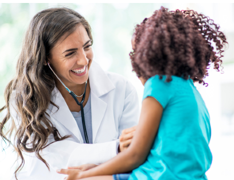 Female Doctor smiling at child