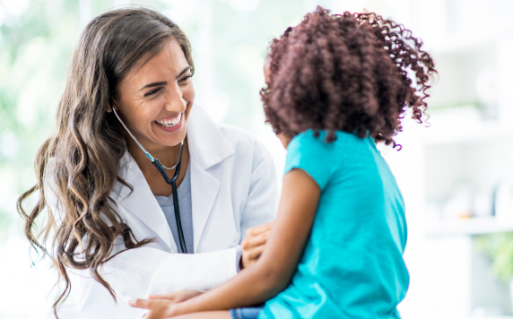 Female Doctor smiling at child