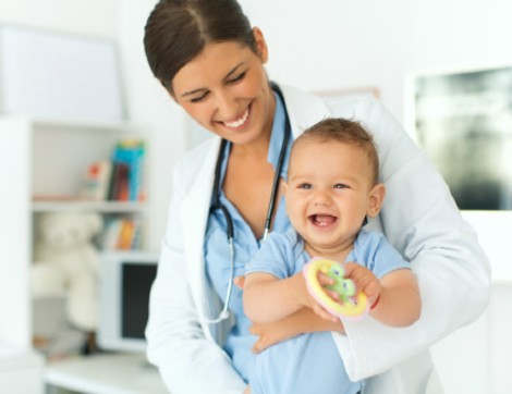 female doctor with infant patient