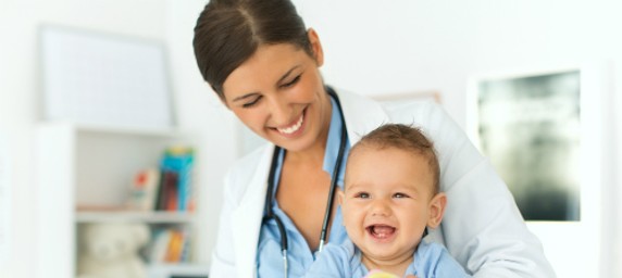 female doctor with infant patient