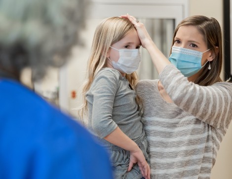 mom checking child's fever