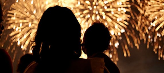 parent and child watching fireworks