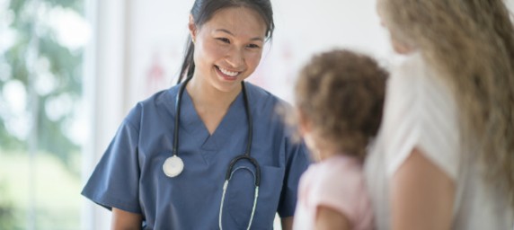 patient with parent and doctor