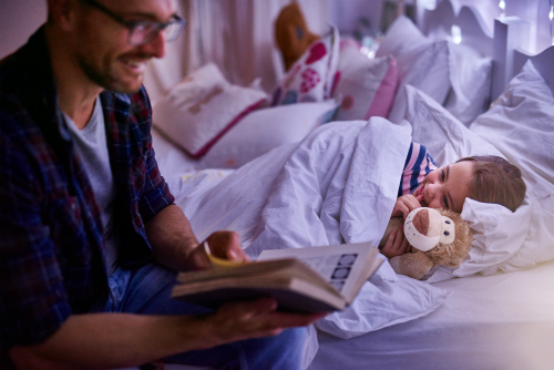 Man reading book to child