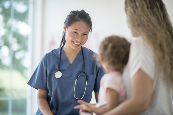 Woman and child meeting with doctor