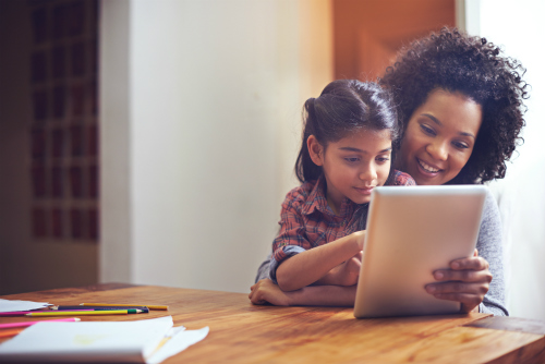 Woman and child looking at tablet