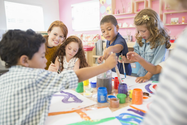 Classroom with teacher and children learning