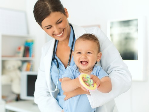 Doctor holding baby