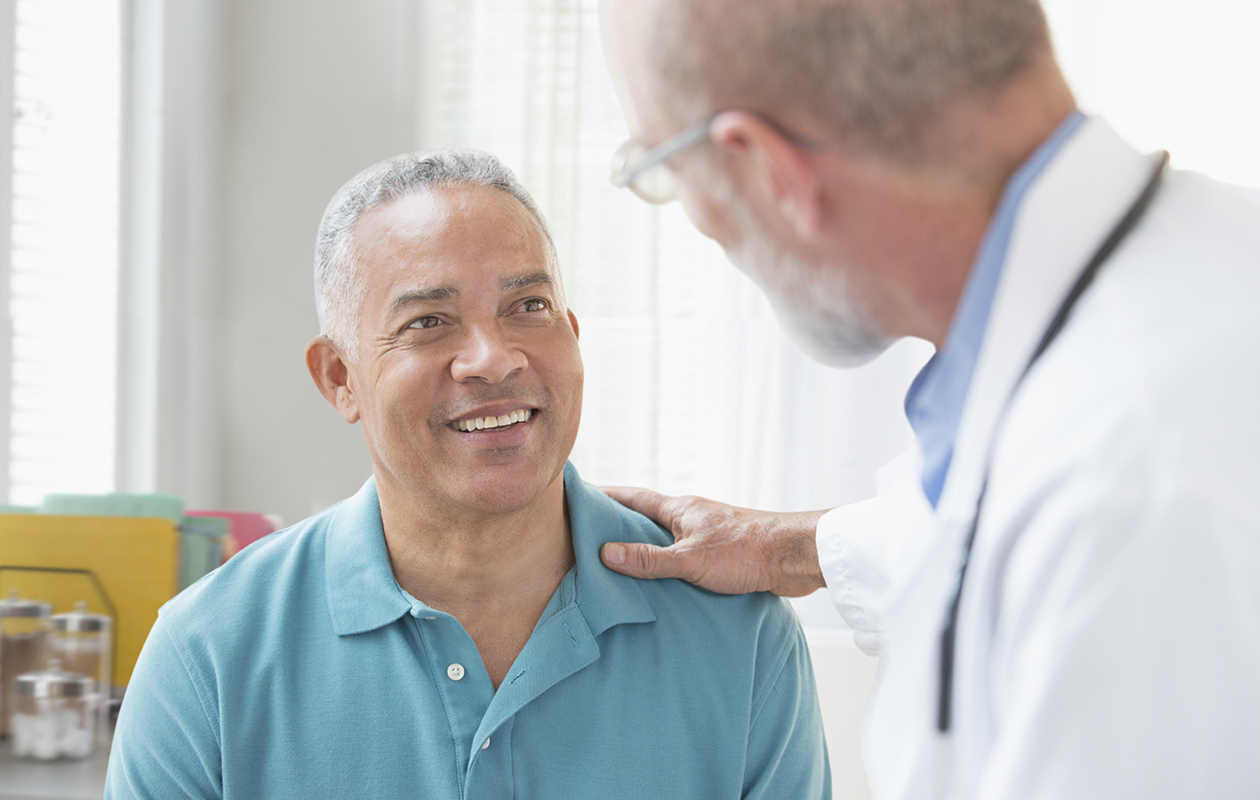 Doctor talking to patient in office