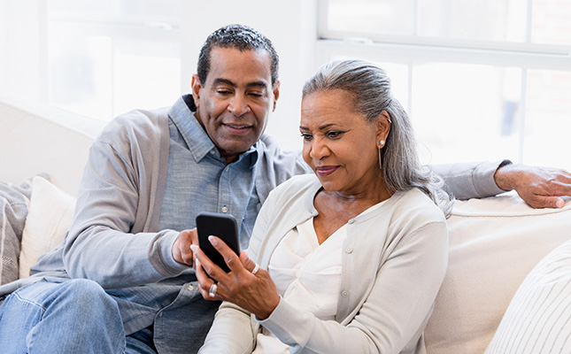 Couple on phone on couch