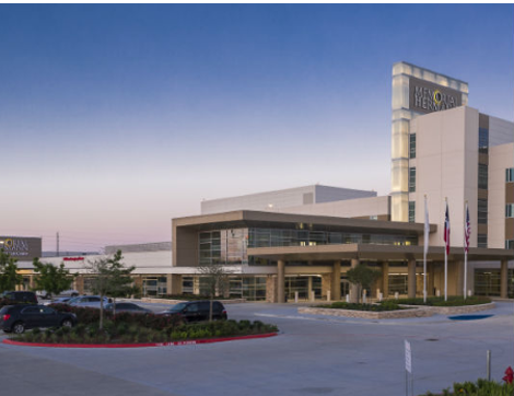 Memorial Hermann hospital set in front of the setting sun.