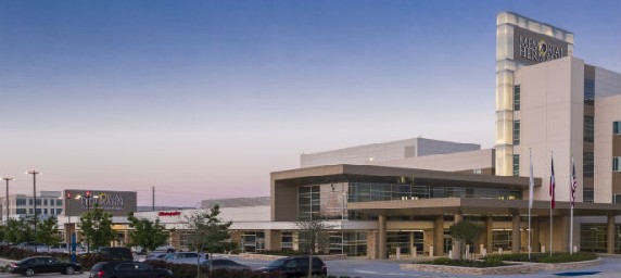 Memorial Hermann hospital set in front of the setting sun.