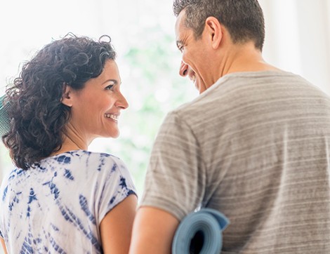 two patients smiling at one another