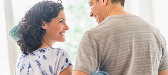 two patients smiling at one another