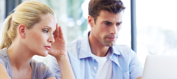 Man and woman at computer screen