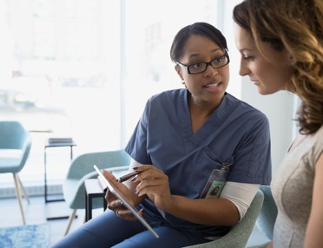 nurse talking with patient