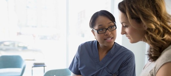 nurse talking with patient