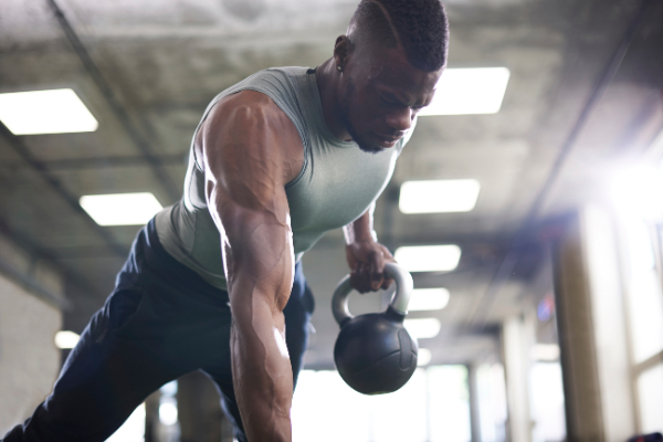 A man exercising with a kettlebell