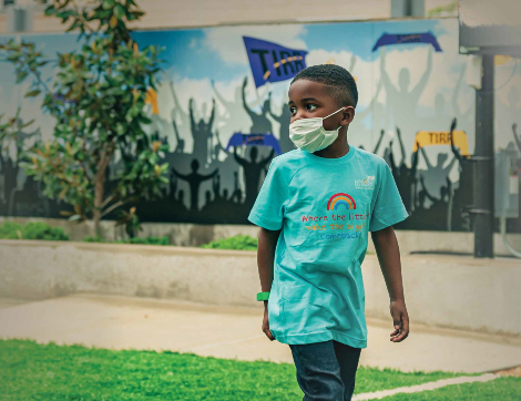 Major Hudlin, a young TIRR Memorial Hermann patient, walks outside.