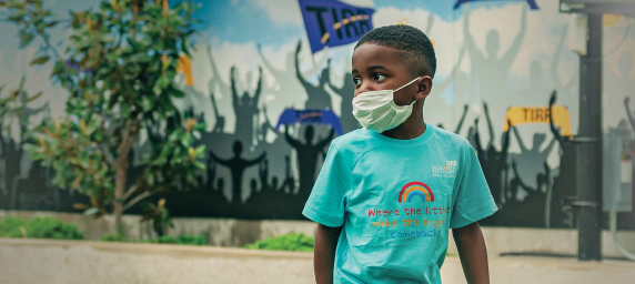 Major Hudlin, a young TIRR Memorial Hermann patient, walks outside.