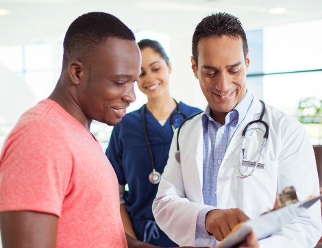 A patient and physician happily go over results.