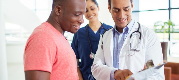 A patient and physician happily go over results.