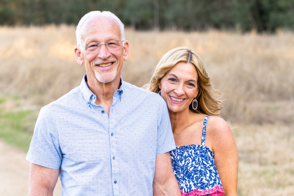 Trauma survivor, Gary, smiles with his wife after burn recovery.