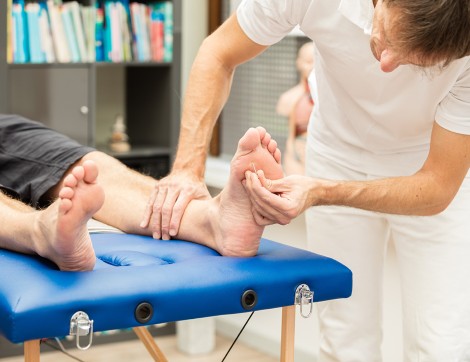 Doctor checking out foot