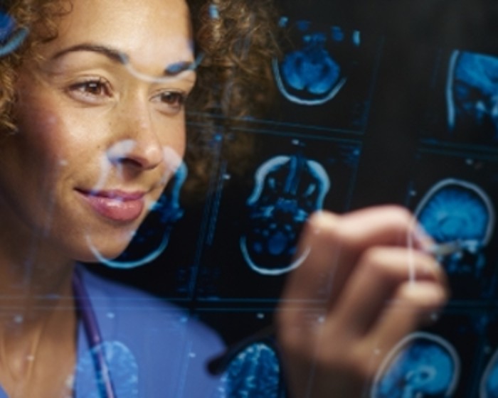 woman looking at brain scans