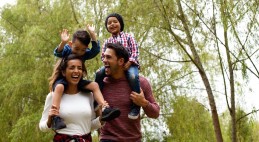 family walking through the woods